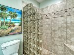 Master bathroom with tile walk-in shower with built-in corner seat